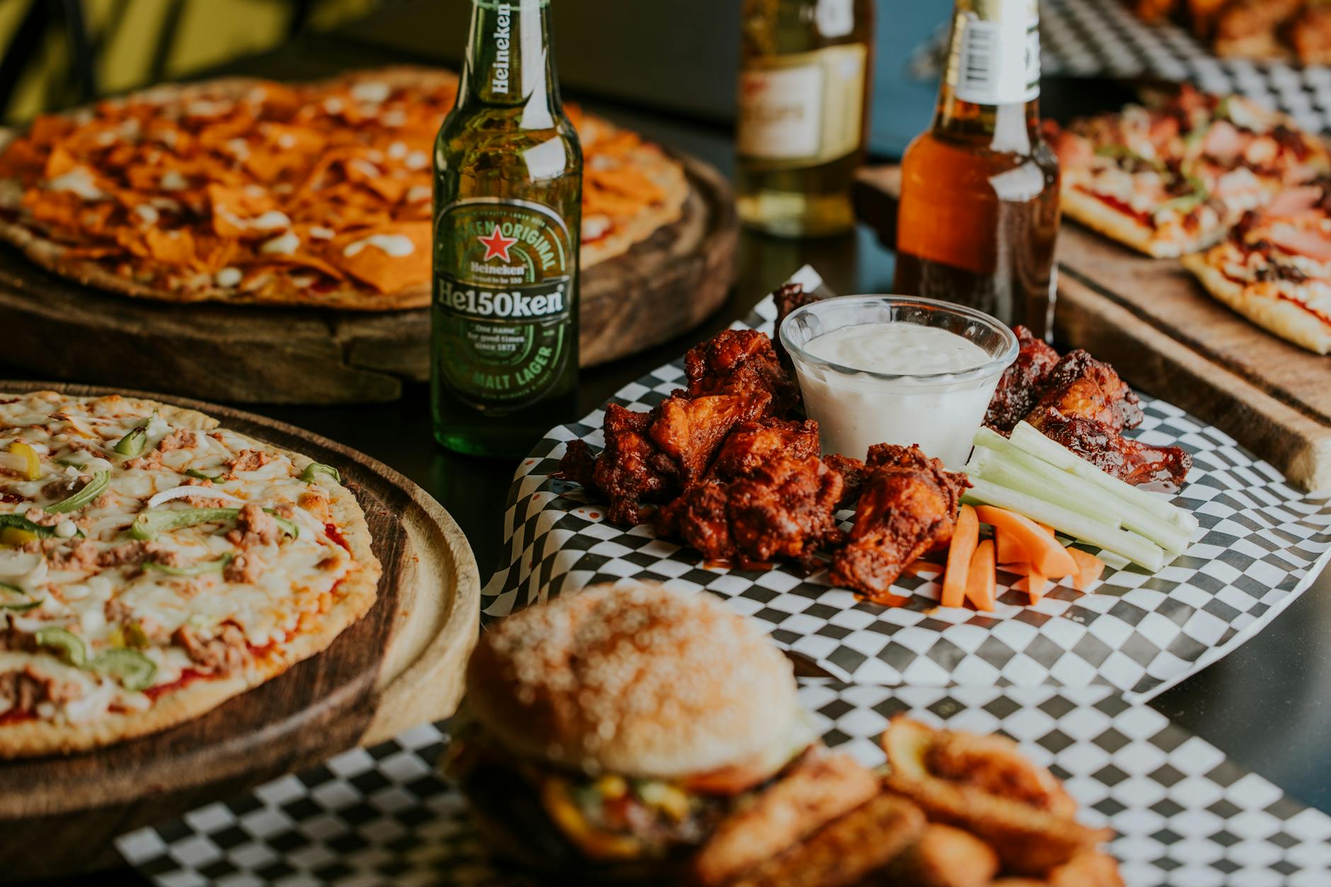 table full of fast food and beer